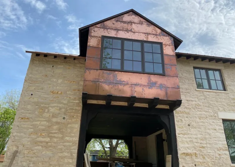 Copper metal panel facade on a stone building for Skylight Installation in Kendale Lakes