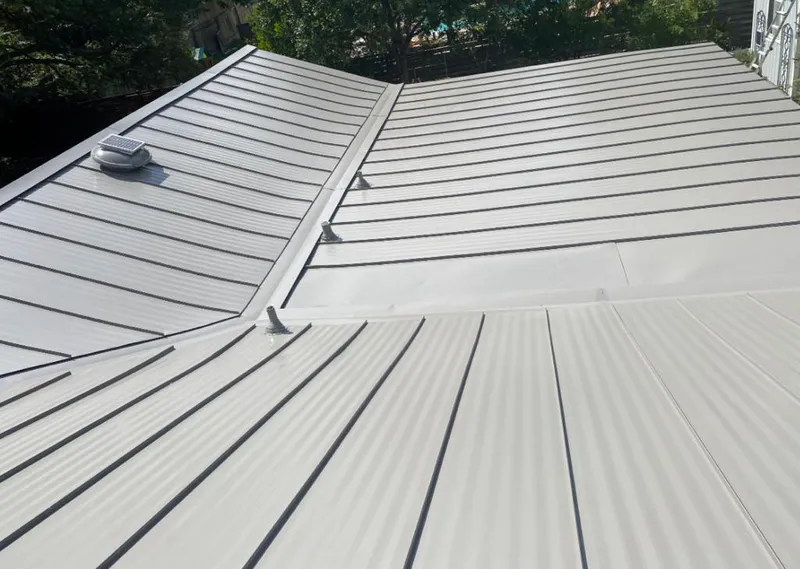 Solar attic fan installed on a metal roof for Roof Ventilation in Kendale Lakes